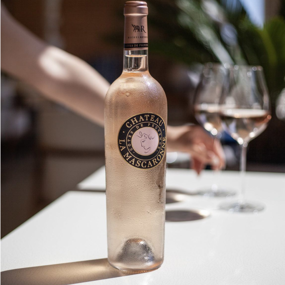Chateau La Marsconne on a table with glasses in the background